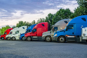 red, white, and blue semi-trucks