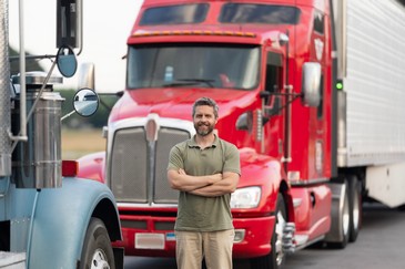 man standing in front of semi